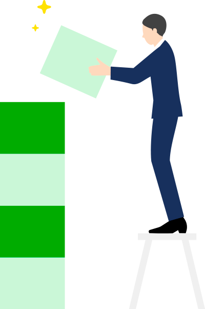 画像:積み木を積み立てるサラリーマン